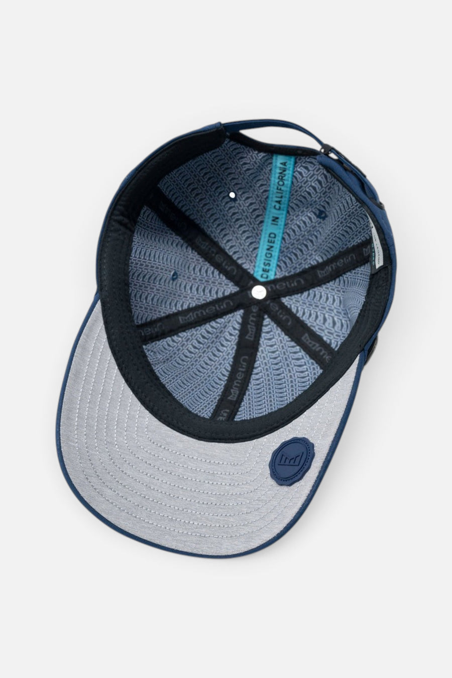 Melin The Legend Hydro Hat in Navy – flat lay