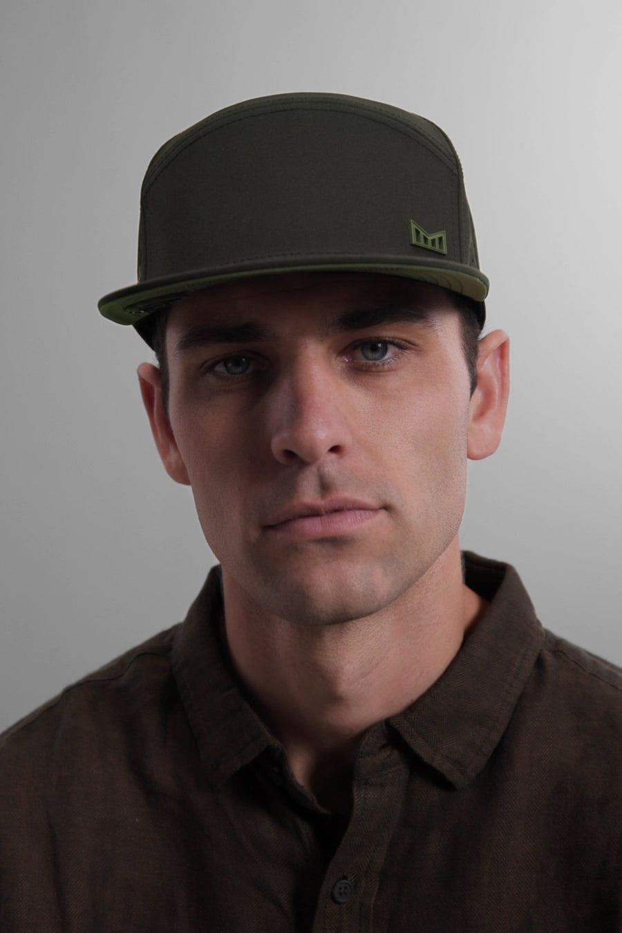 Melin Trenches Icon Hydro Hat in Black Forest – flat lay