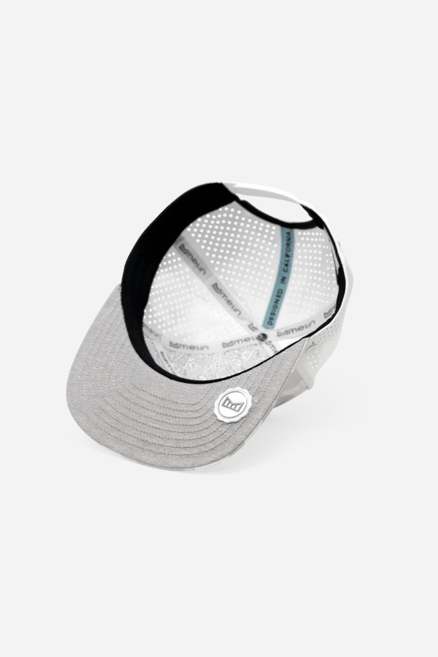 Melin Trenches Icon Hydro Snapback Hat in Snow Camo – flat lay