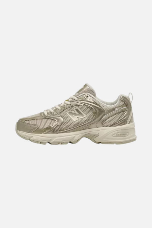 New Balance Women's 530 Sneaker in Gold Metallic