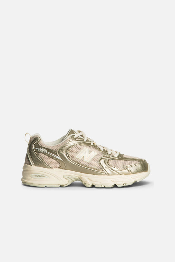 New Balance Women's 530 Sneaker in Gold Metallic