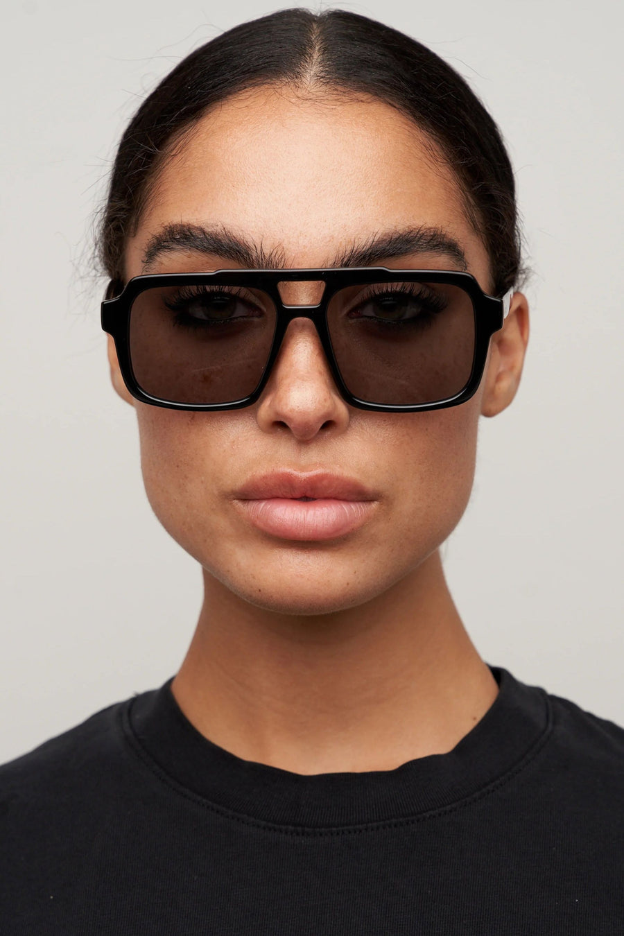 Otra Tame Sunglasses in Black and Smoke – back view