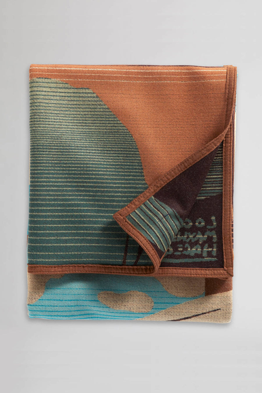 Pendleton Resting Place Throw Blanket in Tan Turquoise – side view