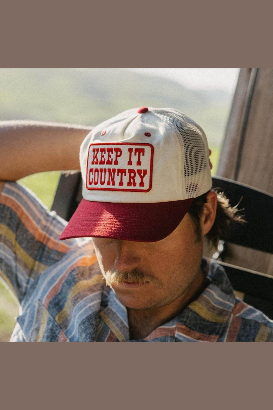 Seager Keep It Country Trucker Hat in Cream/Red – on model