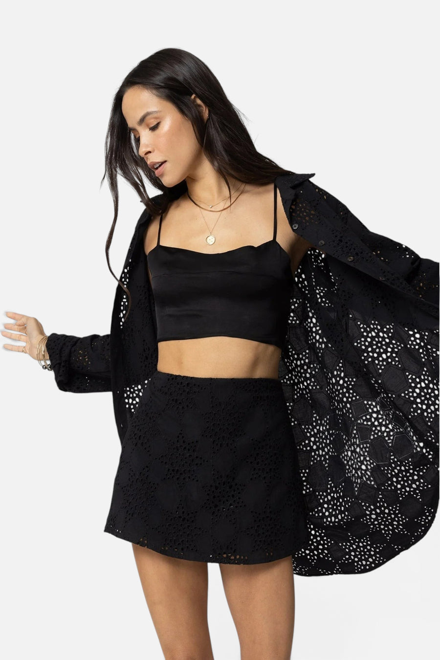 Stillwater The Eyelit Slip Mini Skirt in Black – flat lay