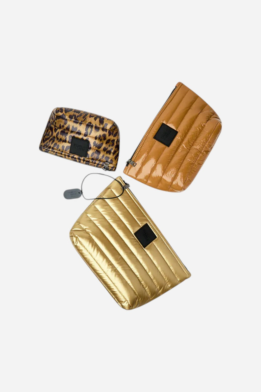 Think Royln Travel Trio Organizational Pouches in Mineral Gold Glossy Nude & Pearl Leopard – flat lay