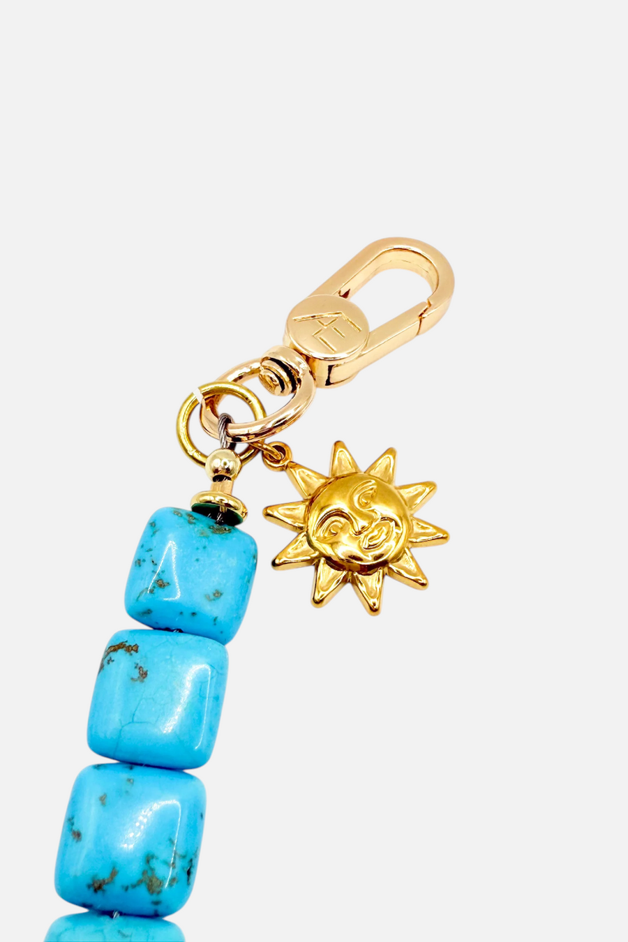The Caep Phoebe Phone Wristlet in Turqoise & Gold – back view
